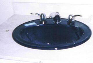 Kohler navy blue sink and Grohe fixtures