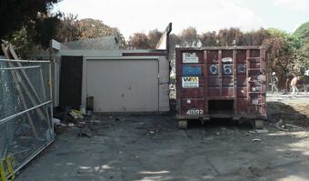 Demolition View of Garage & Dumpster