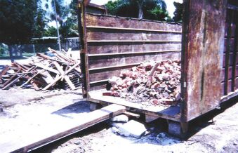Dumpster with Bricks from Fireplace