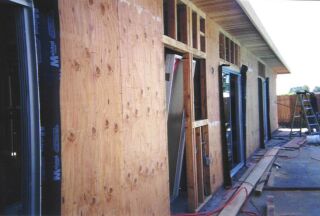 Juan Delgado working on the North side of the house
